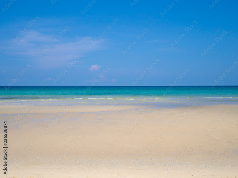 Blue sea sky and white sand at nice tropical beach sunny day in summer.