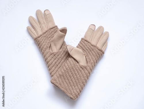 Beige gloves with touchscreen on a white background, double, textile and wool