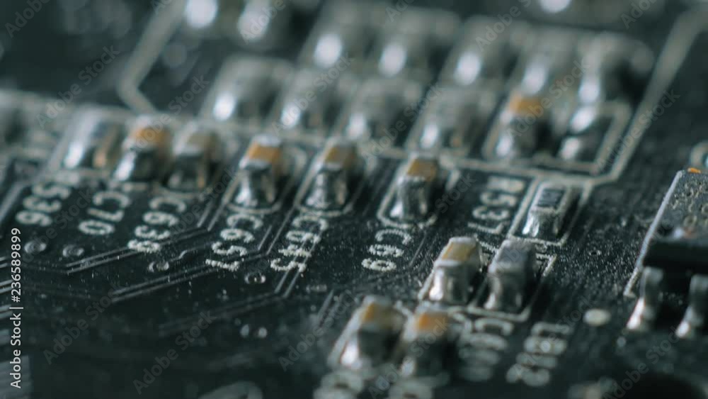 Computer parts macro closeup. Camera moving above structures of chips, microchips and processors on used board. Computer parts macro closeup. Camera moving above structures of chips, microchips and processors on used board.