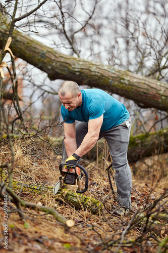 Lumberjack working with chainsaw