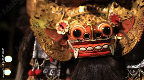 Balinese Asian magical Dragon mask figure used in ancient culture performance spectacle outdoor Indonesia South East Asia photo