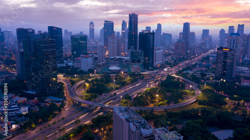 Tableau sur toile Semanggi intersection with skyscrapers at dawn
