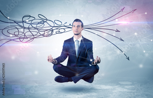 Businessman levitates in yoga position and systematize with thinking concept 