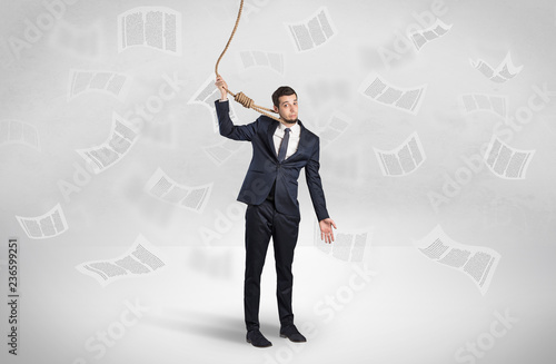 Young burnout businessman with flying documents concept photo