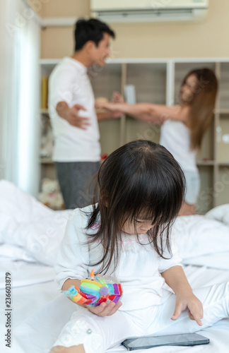 parents quarrel in bedroom with daughter