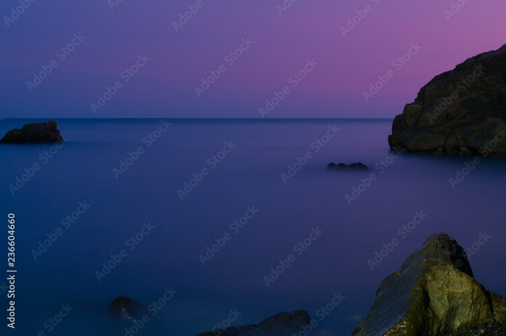 The sea and the stones after sunset