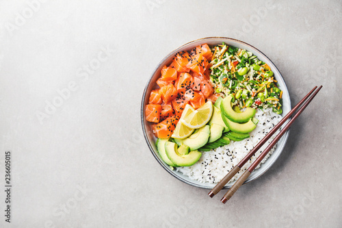 Poke bowl with salmon served in bowl photo