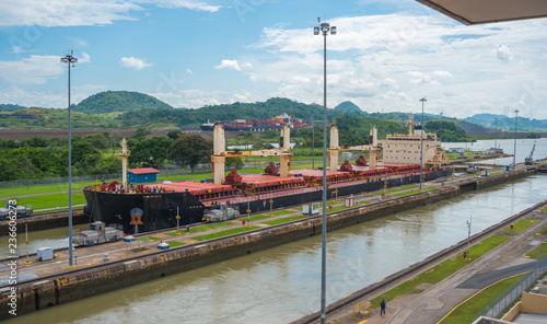 Large cargo ships pass through the Panama Canal locks.  This everyday event, provides income from both fees and tourism for the whole country.