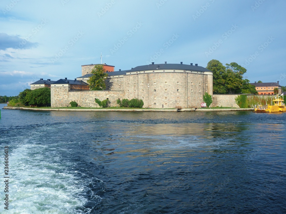 Vaxholm fortress and the yellow Kastellet ferry in the Stockholm Archipelago, Sweden