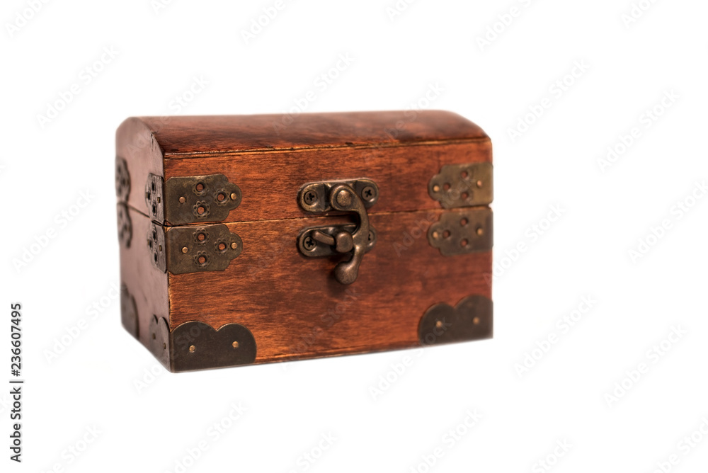 Beautiful wooden box with an iron forged lock on a white background Beautiful wooden box with an iron forged lock on a white background