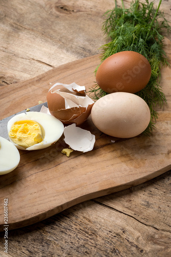 Baked eggs on wooden background