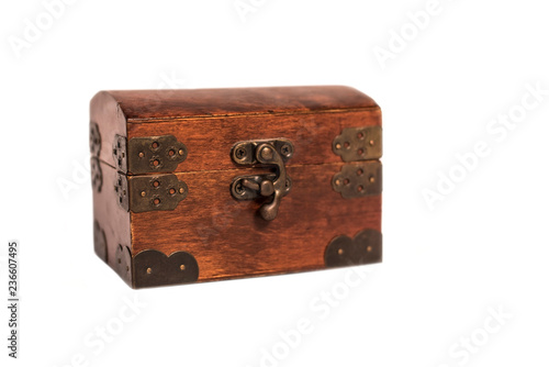 Beautiful wooden box with an iron forged lock on a white background