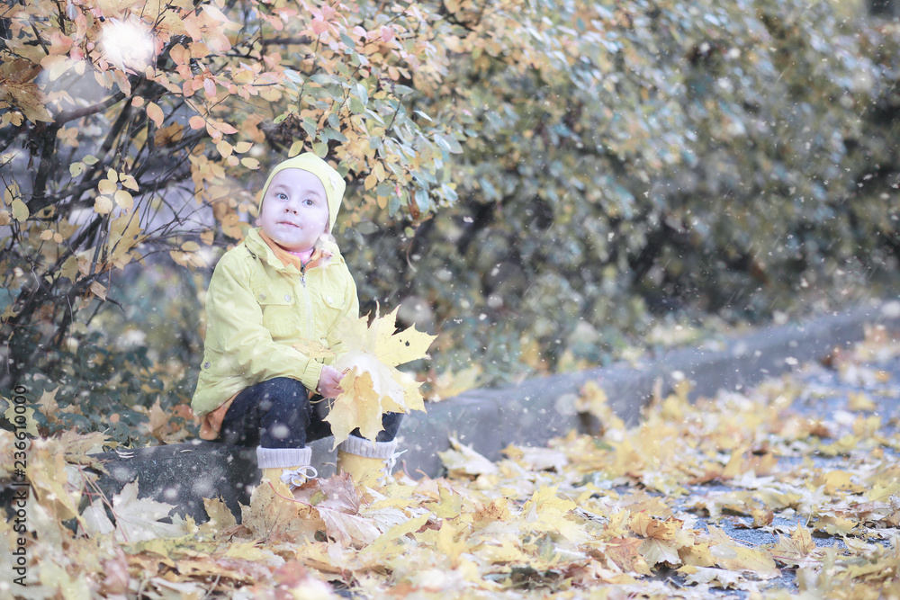 Kids walk in the park first snow Kids walk in the park first snow