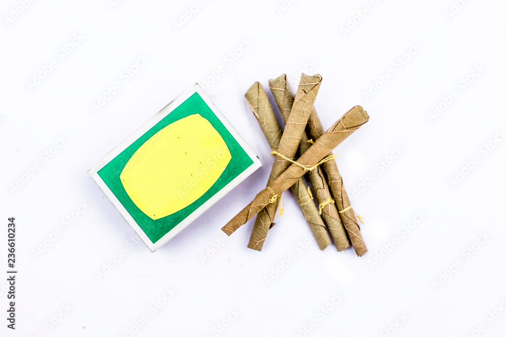Close up of Mini cigar or mini cigarette or bidi or beedi isolated on white  with a matchbox. Stock Photo | Adobe Stock