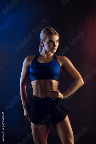 Athletic blonde cropped portrait against wall