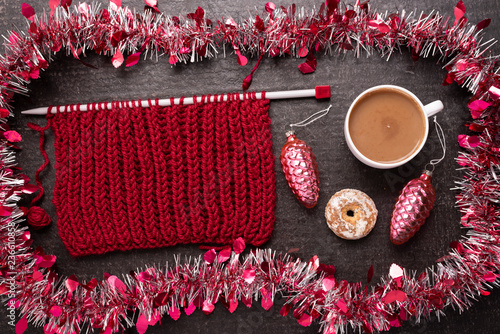 Christmas composition with knitting, coffee and decoration