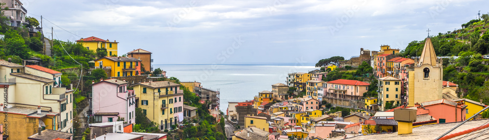 beach streets and colorful houses on the hill in Riomaggiore in Cinque Terre in Italy 