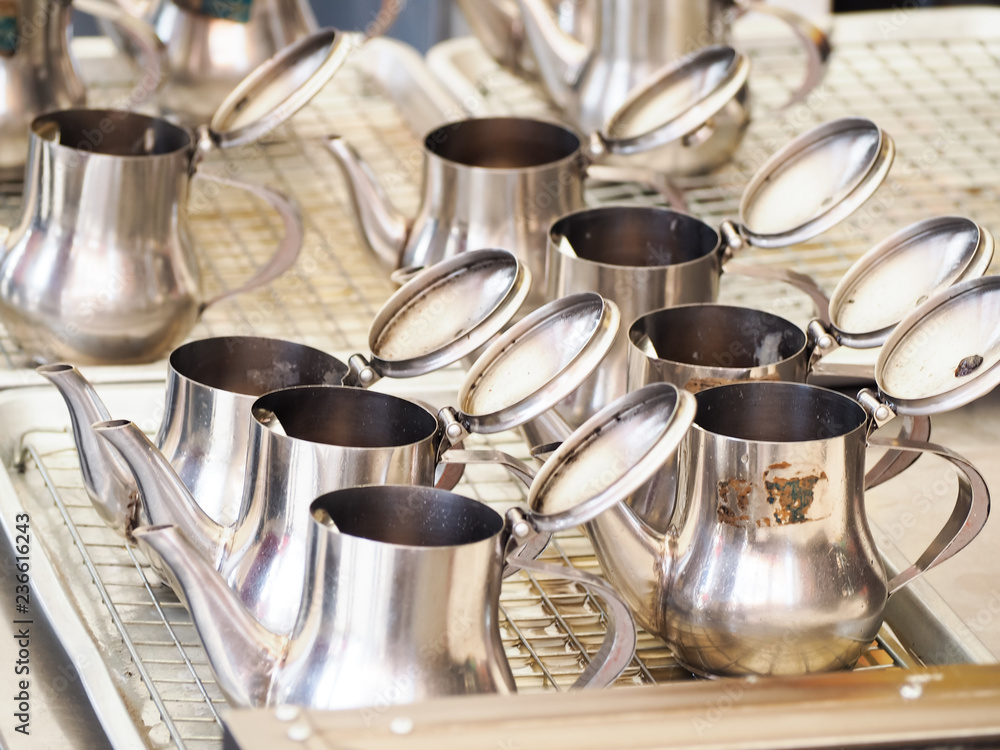 stainless jugs contained oil lamp at Thai temple. stainless jugs contained oil lamp at Thai temple.