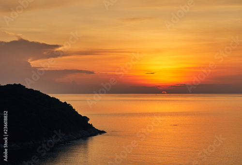  Spectacular sunset over sea lagoon and island 