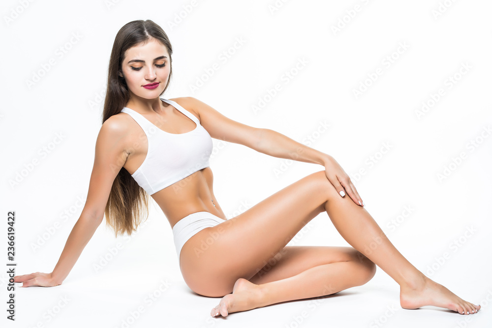 People, beauty, epilation and bodycare concept. beautiful woman with sexy legs sitting on floor over white background People, beauty, epilation and bodycare concept. beautiful woman with sexy legs sitting on floor over white background