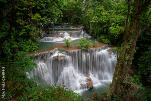 Huay mae khamin waterfall, this cascade is emerald green and popular in Kanchanaburi province, Thailand. © wiratgasem