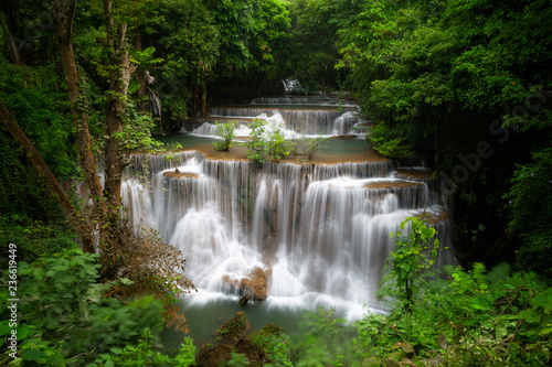 Huay mae khamin waterfall, this cascade is emerald green and popular in Kanchanaburi province, Thailand. © wiratgasem