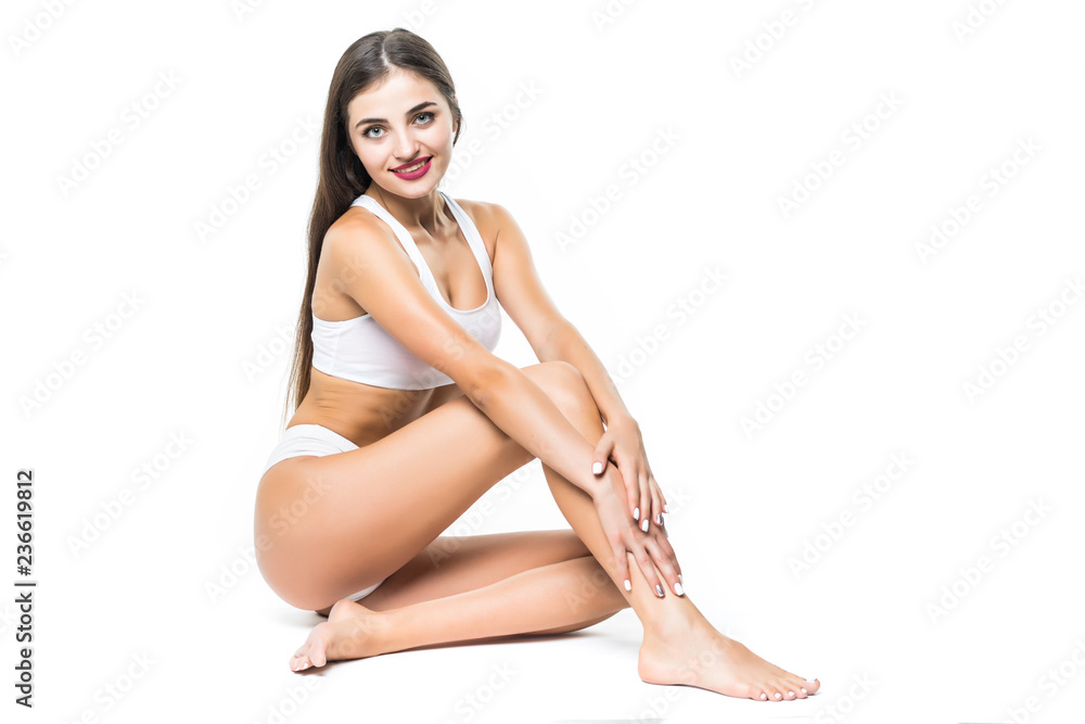 People, beauty, epilation and bodycare concept. beautiful woman with sexy legs sitting on floor over white background People, beauty, epilation and bodycare concept. beautiful woman with sexy legs sitting on floor over white background