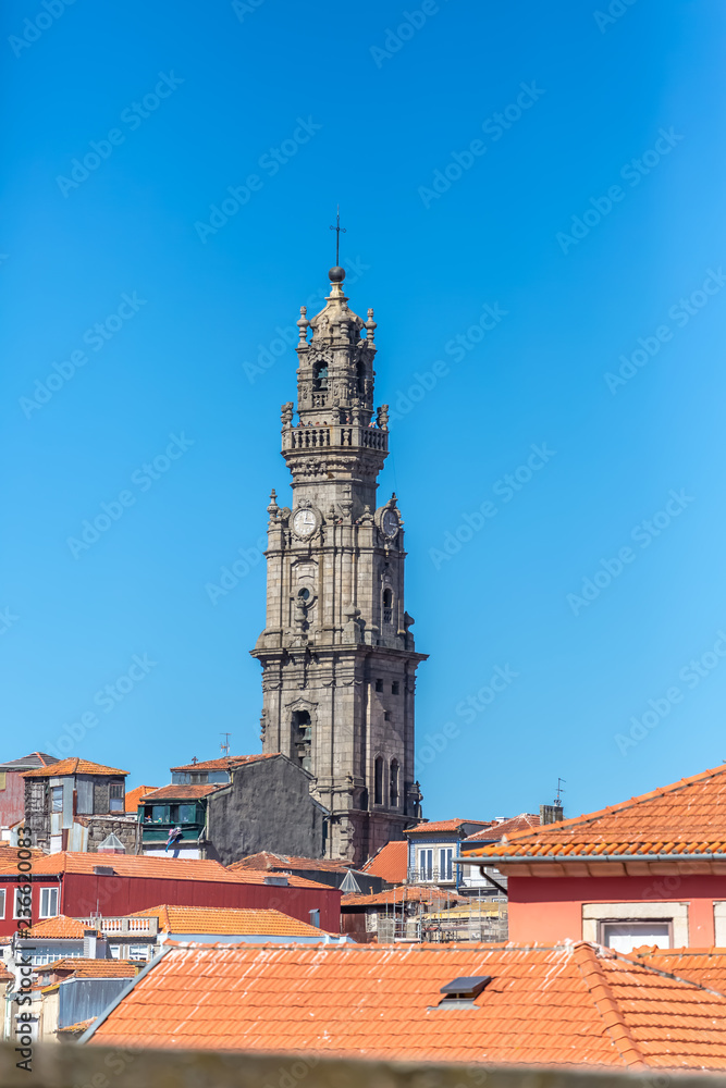 View at the Clerigos tower, baroque icon on Porto city, roof buildings and sky