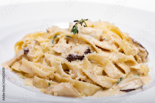 Pasta with white mushrooms in creamy sauce. 
