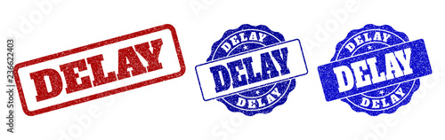 DELAY scratched stamp seals in red and blue colors. Vector DELAY labels with grunge style. Graphic elements are rounded rectangles, rosettes, circles and text captions.