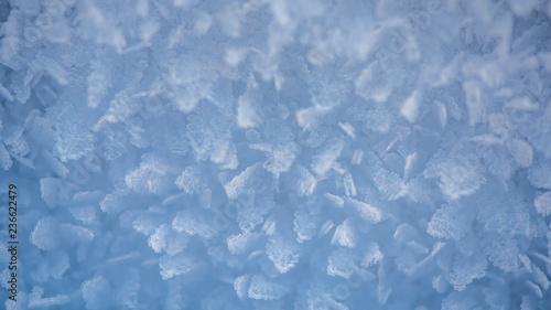 Macro look of snowflakes, snow crystals. Abstract winter background, banner