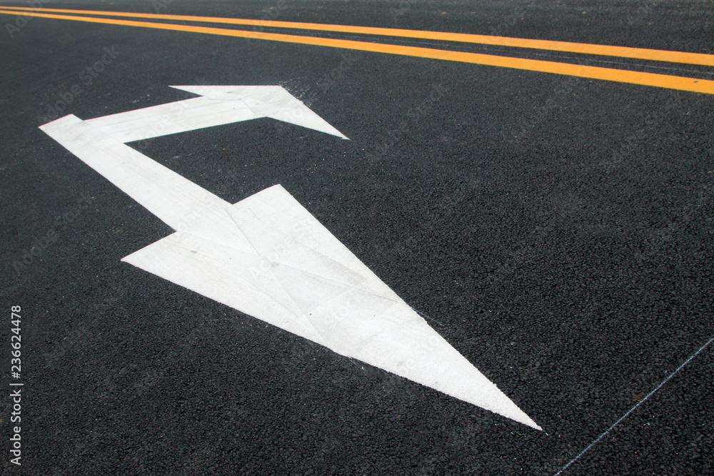 Turn down arrow on the asphalt road Turn down arrow on the asphalt road