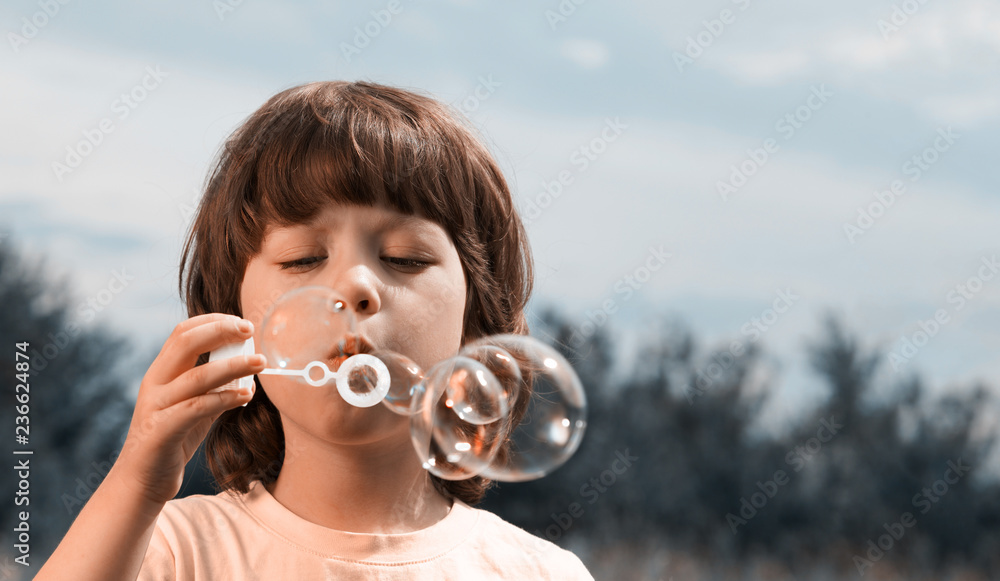 happy boy play in bubbles outdoors happy boy play in bubbles outdoors