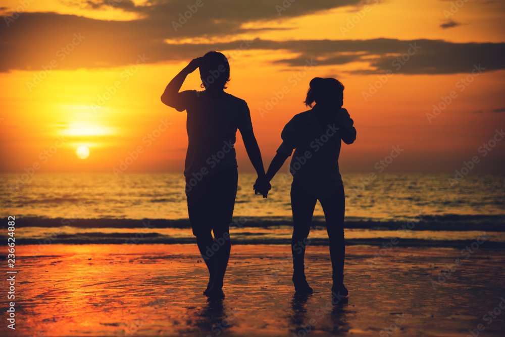 Asian lovers happy and having fun holding hands. Travel beach summer vacation. Travel  relax on the beach vacation. in summer