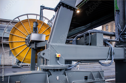 Cable drum with yellow wire. Mobile gangway for cruise ships in the port. photo