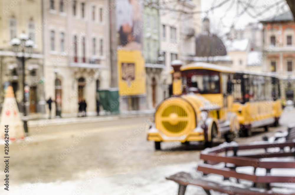 Blurred winter background city tourist train tour excursion New Year faritale Christmas Miracle holiday mood atmosphere lifestyle blizzard cold falls snow panorama old city Blurred winter background city tourist train tour excursion New Year faritale Christmas Miracle holiday mood atmosphere lifestyle blizzard cold falls snow panorama old city