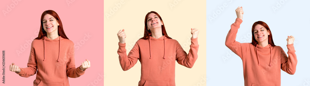 Set of Young redhead girl with pink sweatshirt celebrating a victory in winner position on colorful background Set of Young redhead girl with pink sweatshirt celebrating a victory in winner position on colorful background