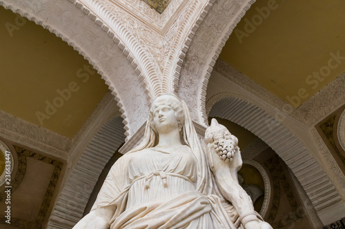 Historic buildings and monuments of Seville, Spain. hands. Statue. Marble.