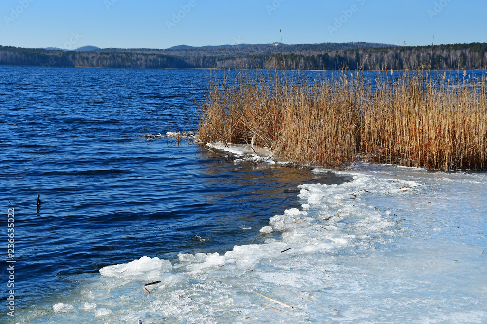 The border of ice and open water on the lake Uvildy. Chelyabinsk region, Southern Urals, Russia The border of ice and open water on the lake Uvildy. Chelyabinsk region, Southern Urals, Russia