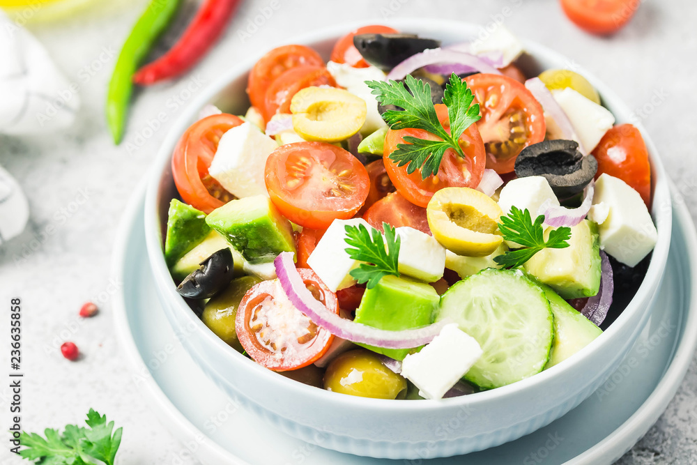 Avocado feta Greek salad in a bowl. Selective focus,close up, space for text. Avocado feta Greek salad in a bowl. Selective focus,close up, space for text.