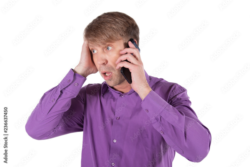 Amazed middle age man talking on the phone on white background Amazed middle age man talking on the phone on white background