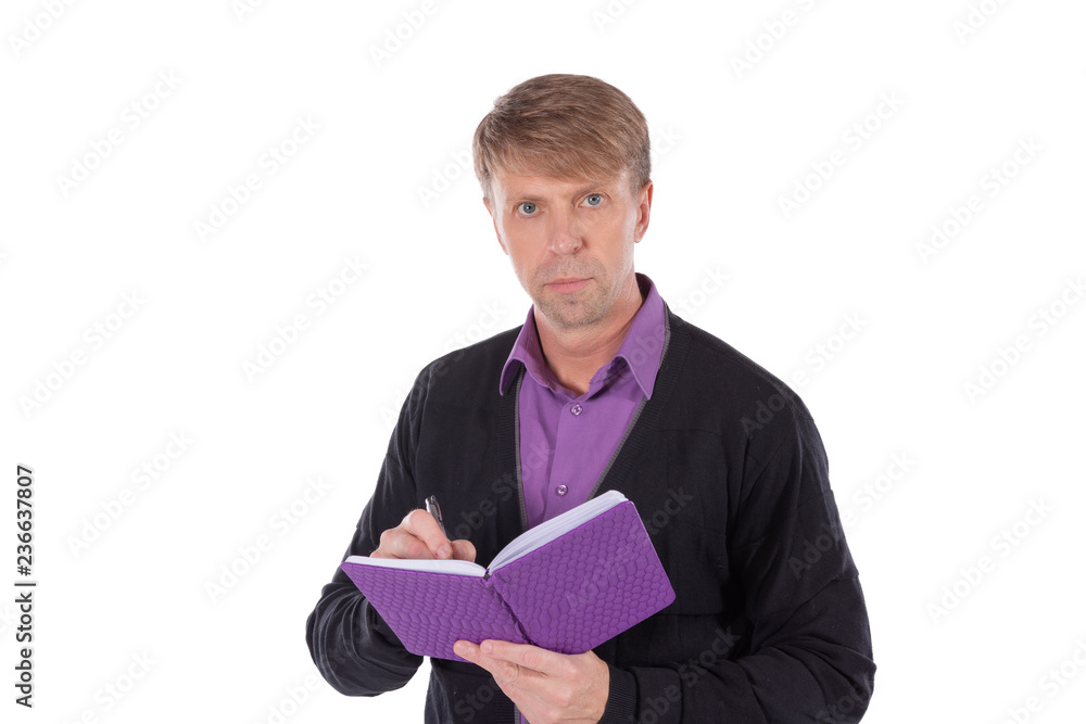 Portrait of middle age man dressed in cardigan writes in a notebook on white background Portrait of middle age man dressed in cardigan writes in a notebook on white background