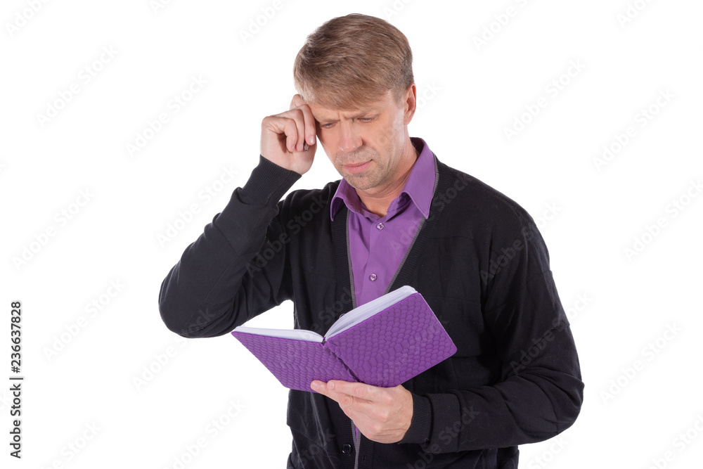 Portrait of middle age man dressed in cardigan writes in a notebook on white background Portrait of middle age man dressed in cardigan writes in a notebook on white background