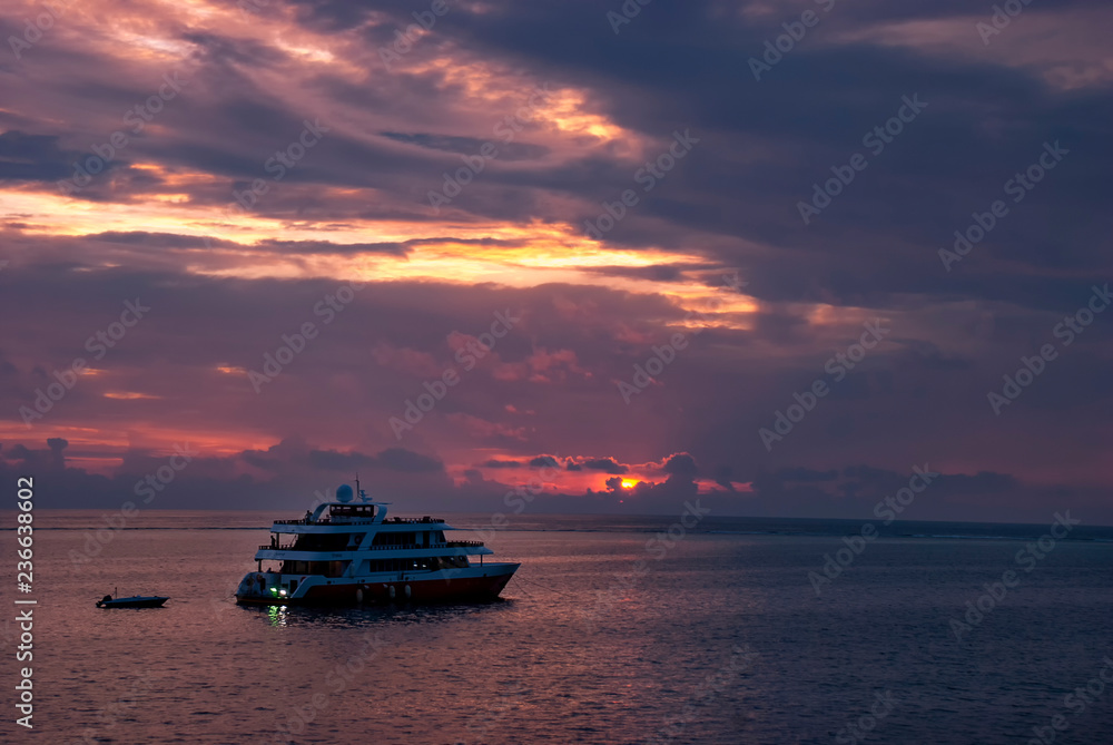 Luxury yacht in the Maldives at sunset Luxury yacht in the Maldives at sunset