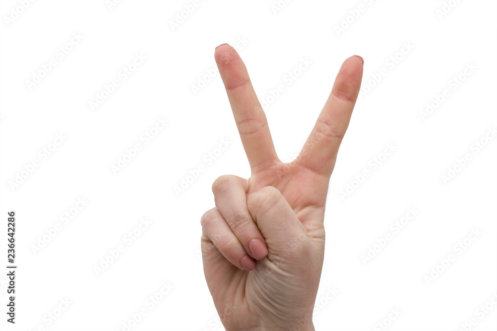 Woman hand and victory sign. Fingers gesture isolated on white background. Caucasian woman showing peace sign with two fingers. Woman hand and victory sign. Fingers gesture isolated on white background. Caucasian woman showing peace sign with two fingers.