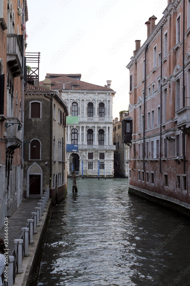 Canal street with walkway in Venice, Italy