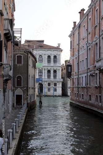 Canal street with walkway in Venice, Italy