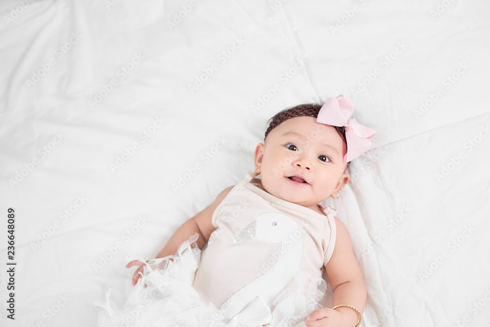 Asian baby girl laying on floor Asian baby girl laying on floor