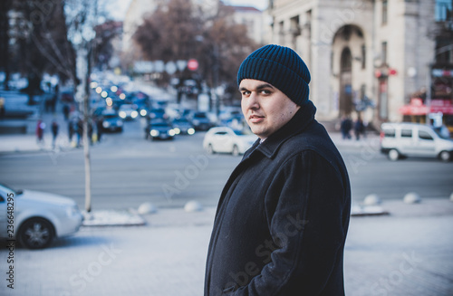 Worried man at city streets. Life of businessman or manager, office worker. Plump guy at center in sad mood © T.Den_Team