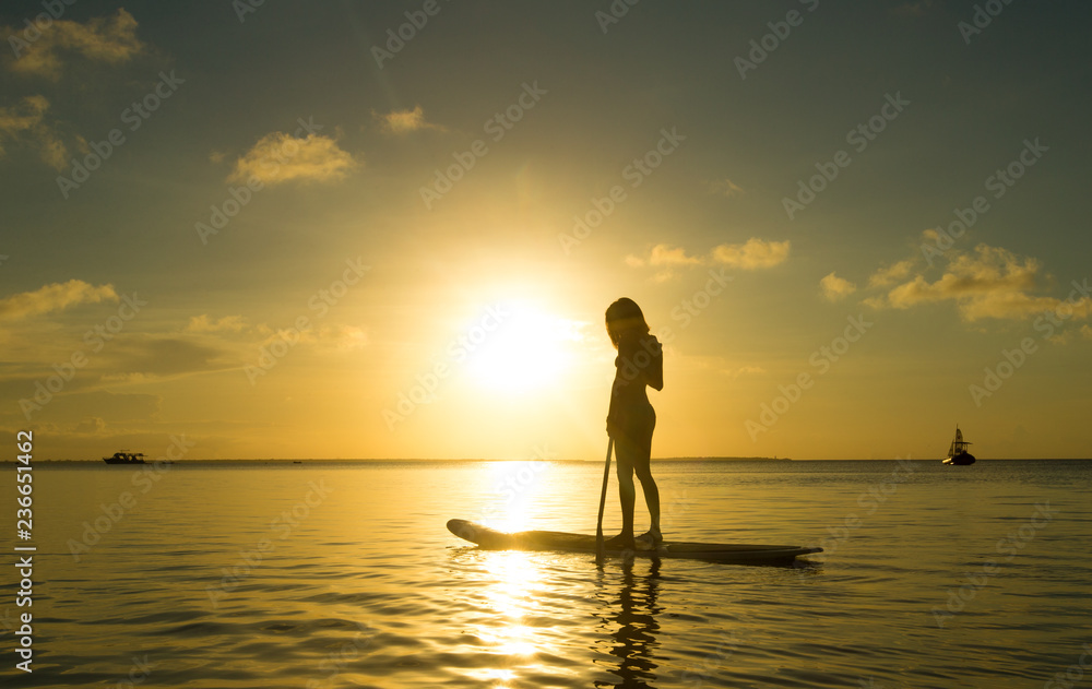 Happy woman relaxes on beach